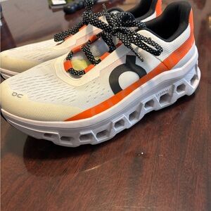 On Running Athletic Shoes in White and Orange